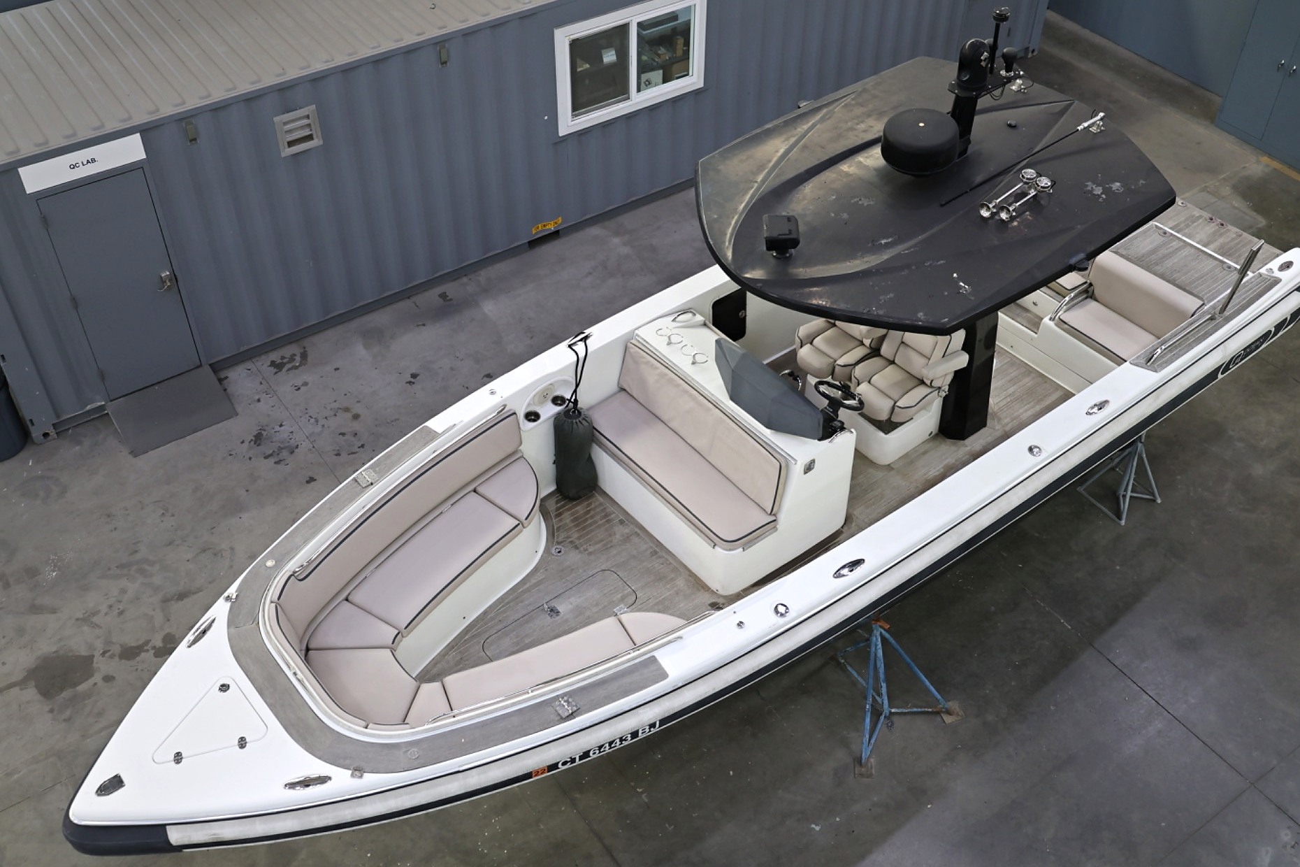 Le Ti, a black and white 2012 Novurania Chase 31, displayed indoors at Hornblower Marine