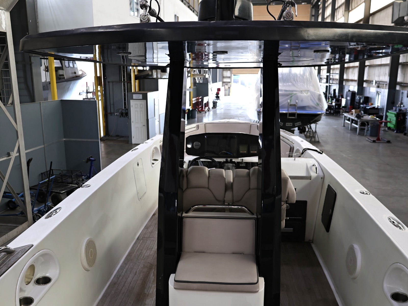 View through Le Ti's open cockpit toward the forward-facing helm seats